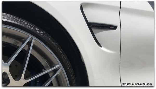 Armor all extreme tire shine on michelin tire on a white BMW M4 Armor all extreme tire shine on michelin tire