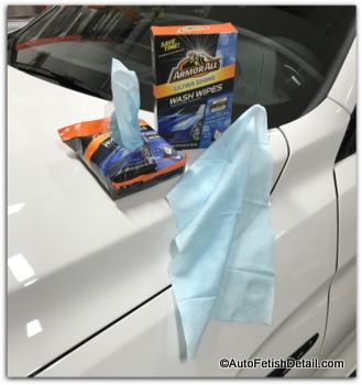 armor all wipes sitting atop a white, BMW M4 armor all wipes