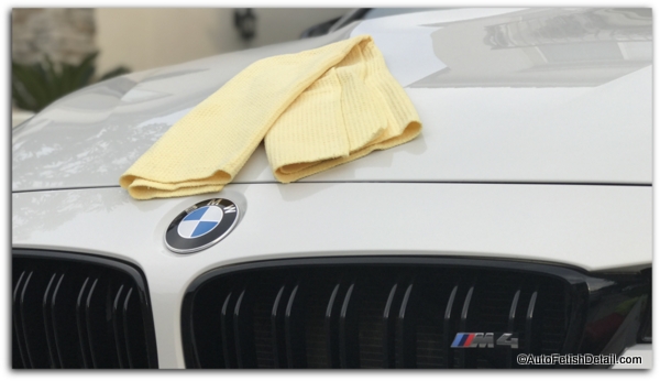 best car drying towel sitting on top of hood of white BMW M4 best car drying towel