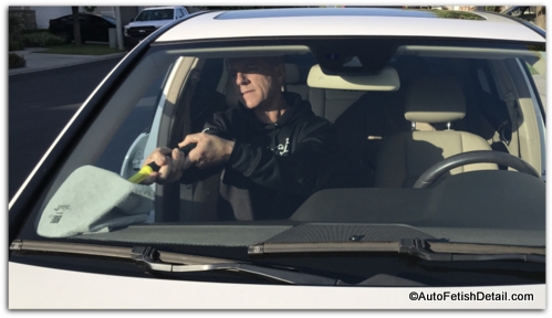 cleaning front car windshield