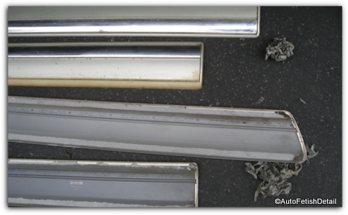 discolored faded truck door rails laying on the ground side by side discolored faded truck door rails