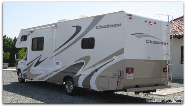 RV with paint, gelcoat, and vinyl decals sitting on gravel driveway RV with paint gelcoat vinyl decals