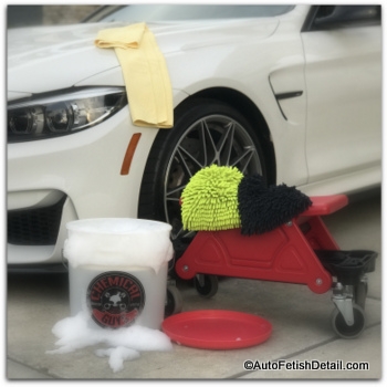 Chemical guys car wash kit in front of white BMW M4 turtle wax car wash alternative